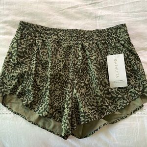 Athleta hustle 4.5 short. Never worn. Size medium.